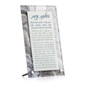 Agate tabletop plaque for Hadlokas Neiros with Hebrew prayer text, gray and white marbled stone with metal stand for Shabbat candle-lighting blessings.