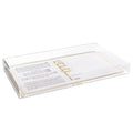 White ceramic havdalah plate with compartments for Shabbat ritual items and gold-trimmed edges on wooden tray.