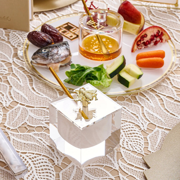 Bee honey dish styled with the Rosh Hashanah simanim foods and honey