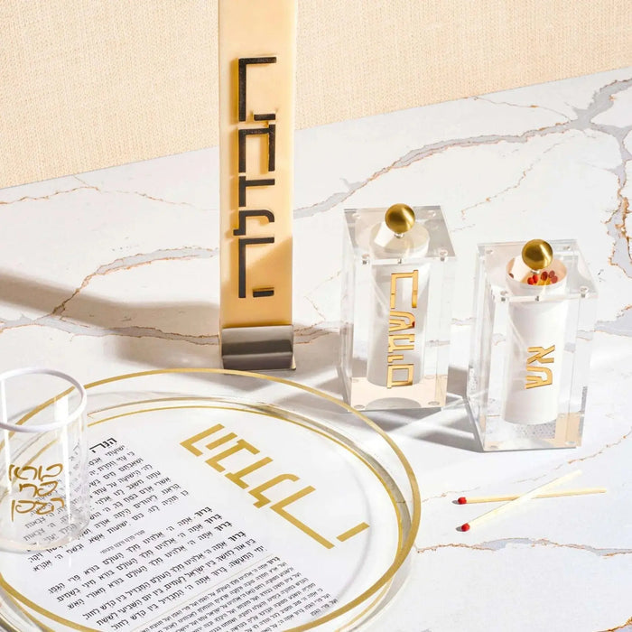 Block Match Jar in gold with decorative stacked blocks, displayed with coordinating tabletop accessories for Shabbat and Havdalah