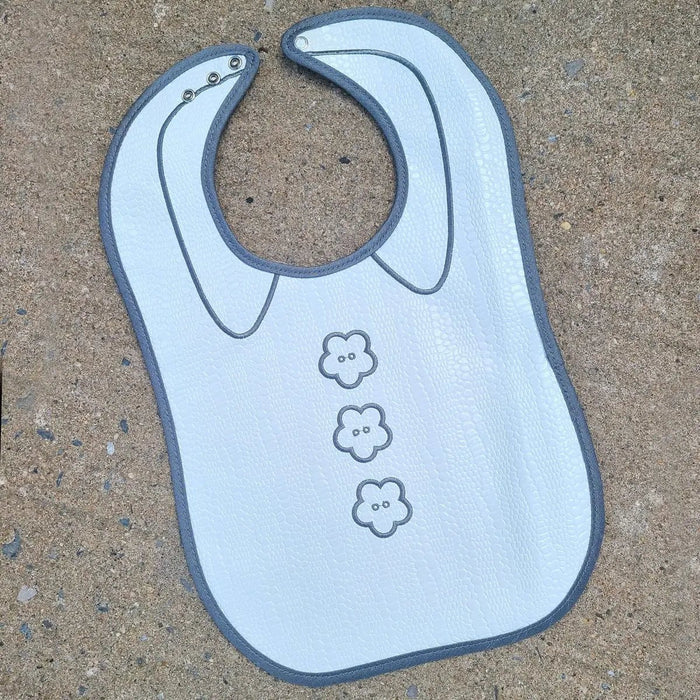Light blue crocodile patent leather bib with three animal face designs, unisex baby bib with snap closure by Waterdale Collection.