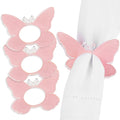 Pink butterfly napkin rings with white centers, set of four elegant table accessories for formal dining and special occasions.