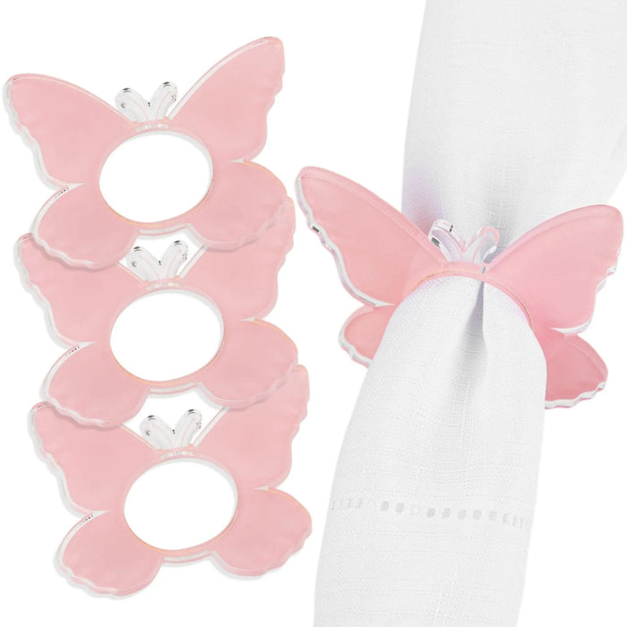 Pink butterfly napkin rings with white centers, set of four elegant table accessories for formal dining and special occasions.
