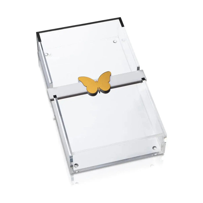 Butterfly Paper Towel Holder with gold butterfly clasp and clear acrylic sides holding white napkins on tabletop