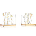 Pair of Chassidim Book End Sculptures in cream and natural wood, featuring minimalist figure designs holding glass panels, perfect for tabletop display.