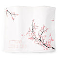 Cherry Blossom Challah Cover by Waterdale Collection featuring delicate pink floral branches on white fabric with silver and gold accents for Shabbat.