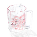 Cherry blossom washing cup with pink floral design on clear acrylic material, featuring a handle and measurement markings.