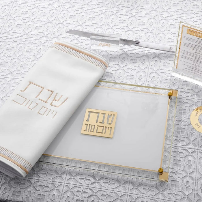 Classic 2.0 Challah Board by Waterdale Collection displayed with design sketches, featuring elegant white ceramic with gold accents for Shabbat dining.