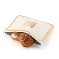 Classic 2.0 Challah Pouch Cover in white and gold leather by Waterdale Collection, displayed with two braided loaves.