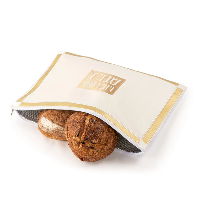 Classic 2.0 Challah Pouch Cover in white and gold leather by Waterdale Collection, displayed with two braided loaves.