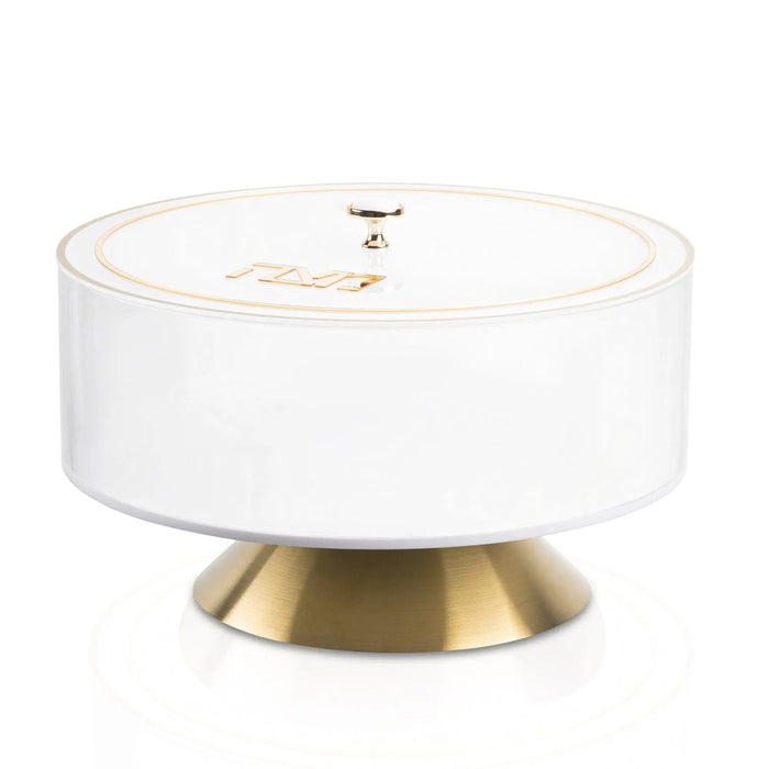Classic 2.0 Matzah Box by Waterdale Collection with white cylindrical body and brass-tone metal base, featuring a finial-topped lid.