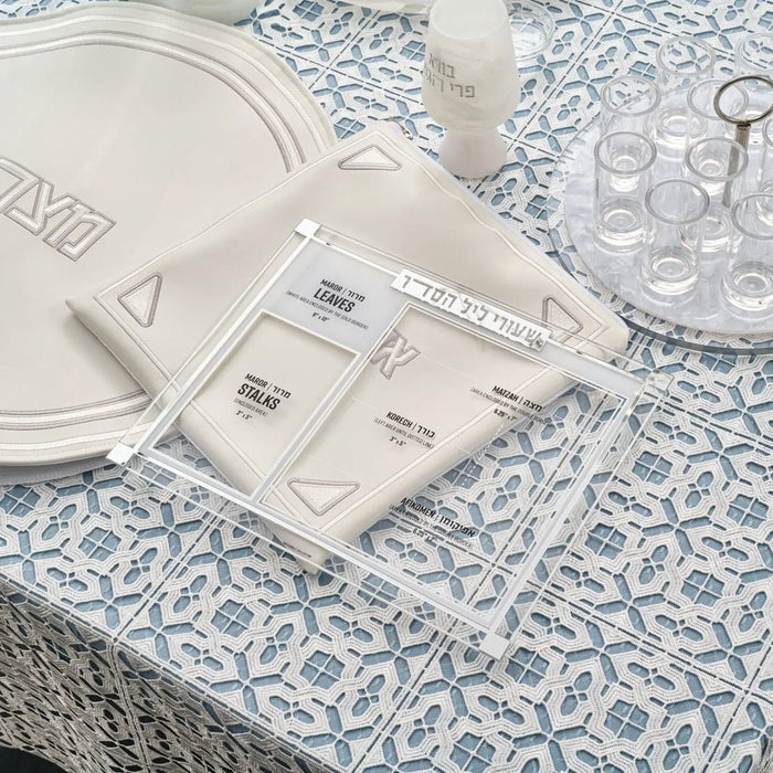 Classic 2.0 Shiurim Card in silver and gold displayed on patterned table with Passover tabletop décor items