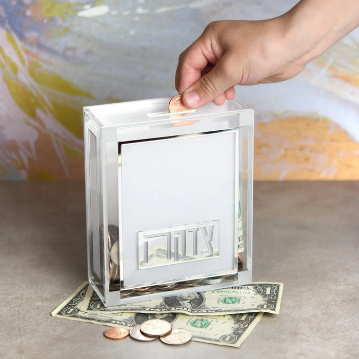 Classic 2.0 Tzedakah Box in silver metal with dollar bills, perfect for charitable giving and Shabbat table.