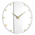 Classic wall clock with white face, gold hour markers, and metal hands against a minimalist design perfect for modern home decor.