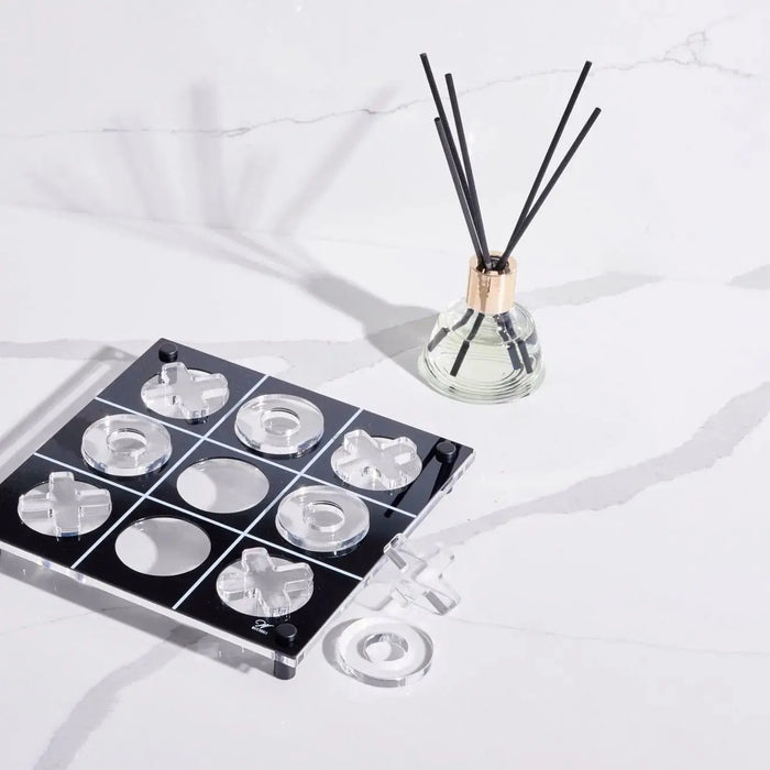Classic Floral Reed Diffuser by Waterdale Collection displayed with black reeds, fragrance bottle, and product packaging on white surface.