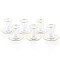 Classic glass cups and saucers with gold trim from Waterdale Collection, arranged in rows on white background, elegant Pesach tableware set.