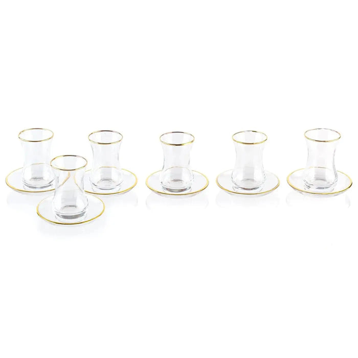 Classic glass cups and saucers set arranged in rows, featuring clear glass construction with saucer bases, ideal for Pesach tableware and kiddush ceremonies.