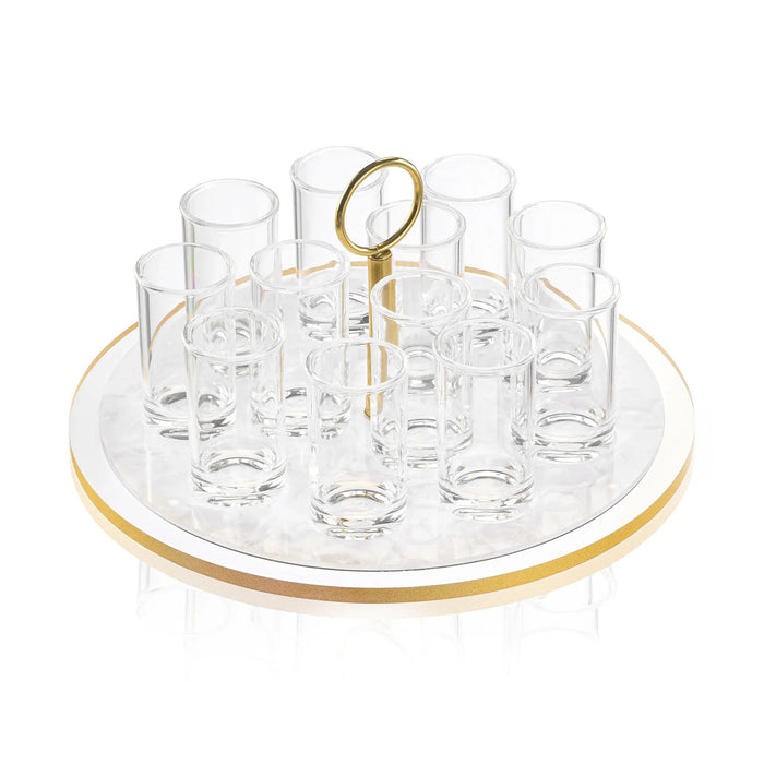 Classic Pearlstone liquor set with eight clear glasses arranged around a central gold-handled serving tray on white pearl marble base