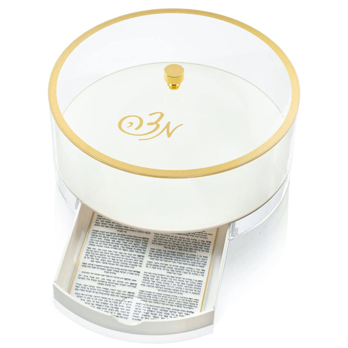 Classic Script Bencher Set Matzah Box in white lucite with gold trim, shown from above displaying the lid design for Pesach.