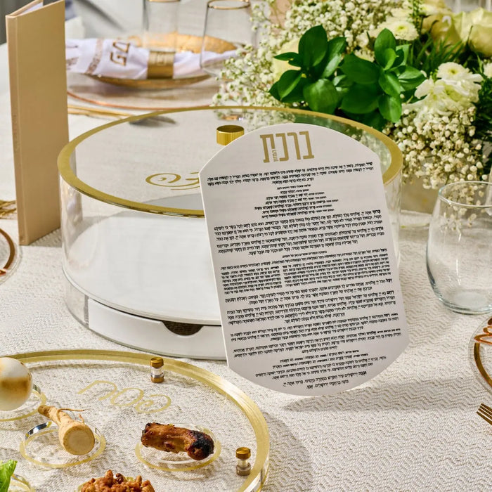 Classic Script Bencher Set Matzah Box in elegant lucite displayed on a white table setting with floral centerpiece and place settings for Passover.