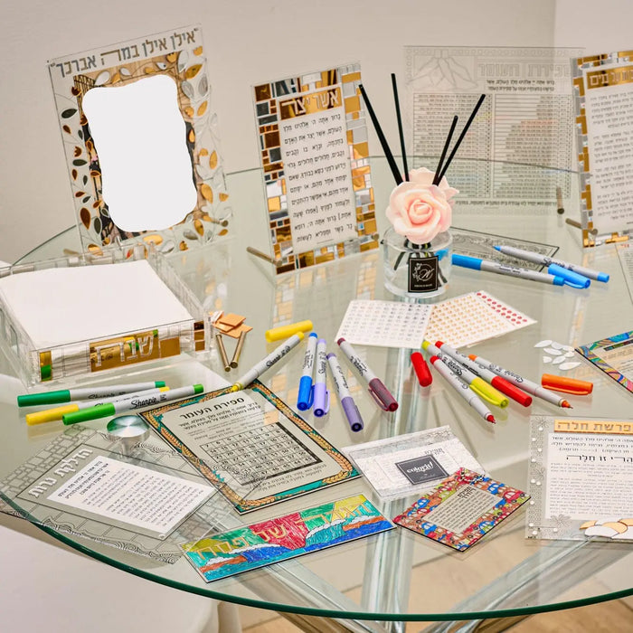 Clear acrylic Sefiras Haomer card with colorful markers and planning materials on desk, ready for counting the Omer activity.