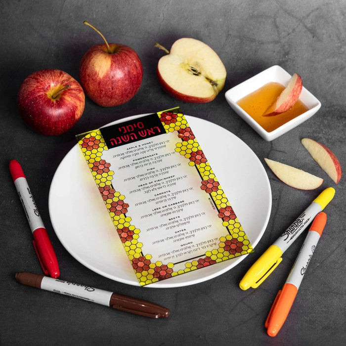 Color It Acrylic Simanim Card with colorful markers and apples on dark surface, ready for Rosh Hashanah activity