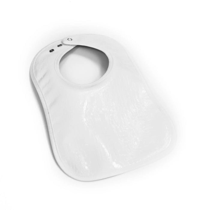 White crocodile patent leather bib with curved neckline and snap closure, designed for babies and toddlers.