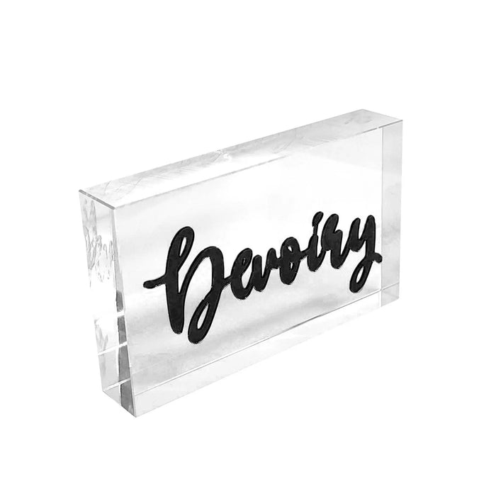 Clear acrylic custom place card with black cursive "Barney" lettering for elegant table settings