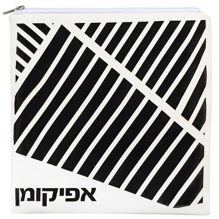 Black and white diagonal laser cut leather Pesach set with Hebrew text, modern geometric design for Passover table.