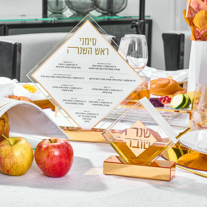 Diamond simanim (סימנים) tabletop with the Rosh Hashanah blessings in white print near diamond honey dish