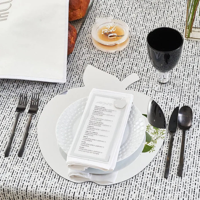 Die-cut apple honey dish on a formal Rosh Hashonah place setting