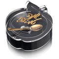 Black and gold apple honey dish with Shana Tova lettering for the Jewish New Year