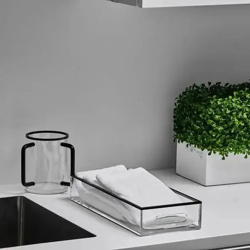 Black and white Edge Bread Tray by Waterdale Collection displayed on a desk with towels and greenery, minimalist serveware design.