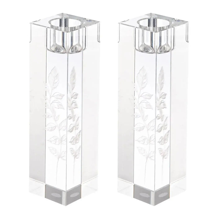 Pair of tall square crystal candlesticks with delicate floral engravings and silver-tone metal tops for Shabbat candle lighting.