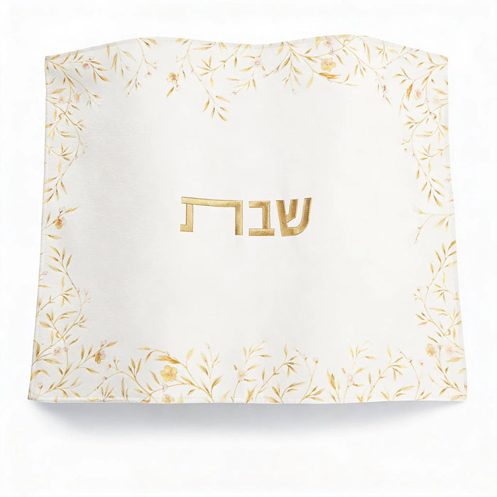 Floral Bird Challah Cover in cream with gold leaf design and Hebrew text, perfect for Shabbat table settings.