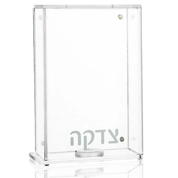 Clear glass Frame Tzedakah Box by Waterdale Collection, modern rectangular design with silver accents, displayed on reflective surface.