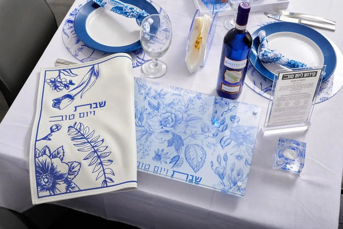 French Toile Challah Board with blue and white porcelain design, featuring decorative pattern, handles, and serving pieces on display.