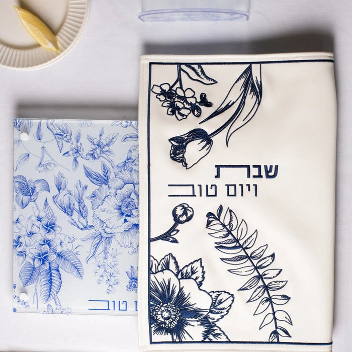 French Toile Challah Cover in cream with navy botanical print, featuring leather accents and traditional Jewish designs for Shabbat.