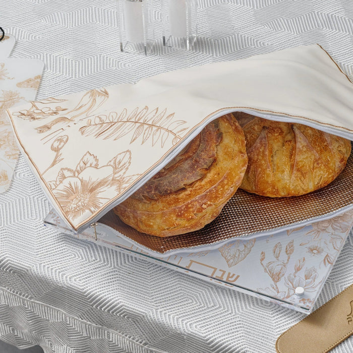 French Toile Challah Board by Waterdale Collection with two golden loaves on decorative blue and white patterned tray.