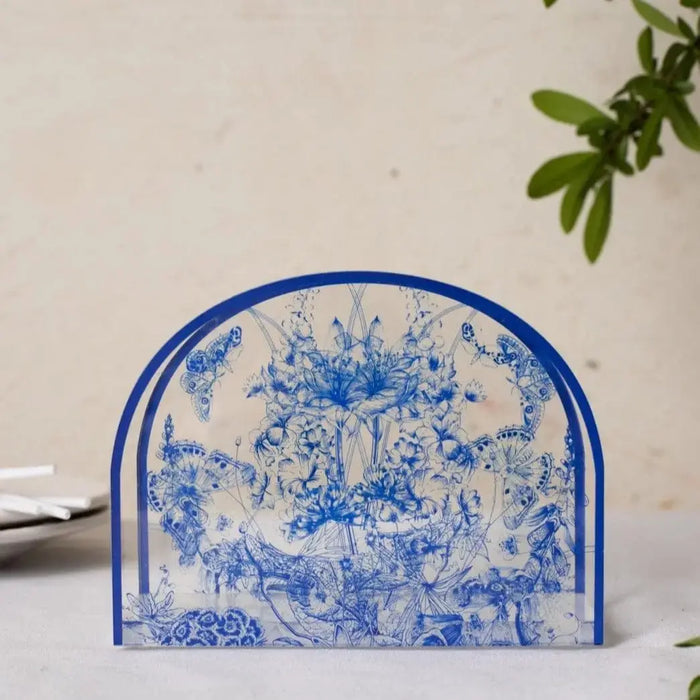 French Toile Napkin Holder in blue and white ceramic with traditional countryside design, perfect for dining and table decor.