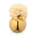 Cream faux floral arrangement in white globe vase with gold stem detail, ideal for home decor or tabletop display.