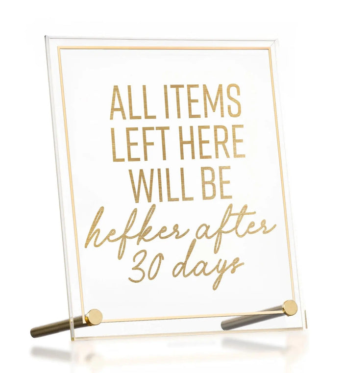 Gold-framed guest room sign with inspirational text and two writing pens, tabletop plaque by Waterdale Collection.
