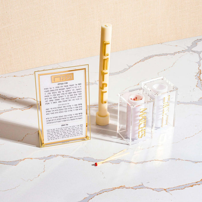 Waterdale Collection Havdalah Set in medium size displaying gold candlestick, spice container, and instruction card arranged on white marble surface.