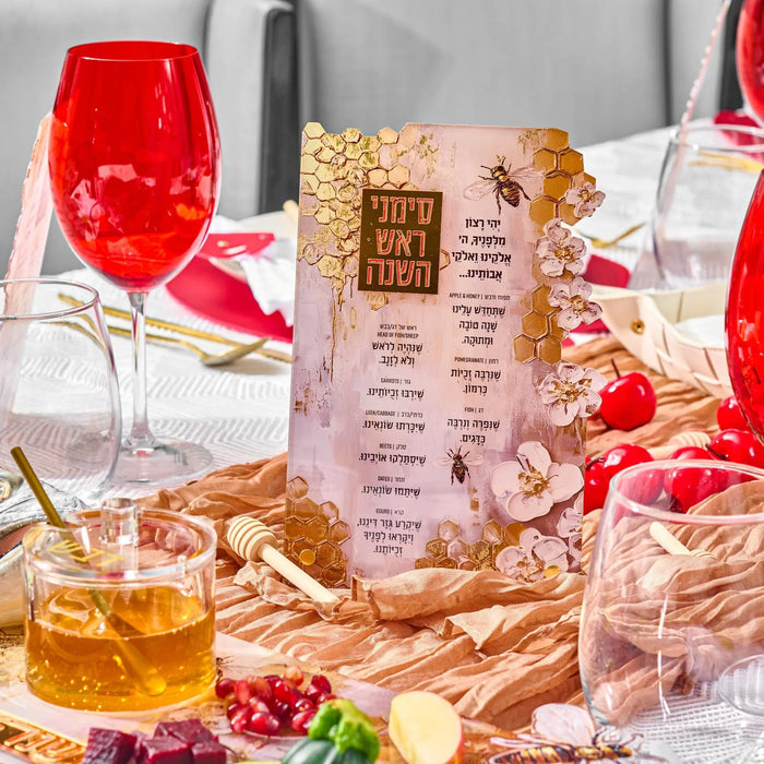 Honeycomb simanim (סימנים) tabletop styled on a Rosh Hashana table with wine glasses