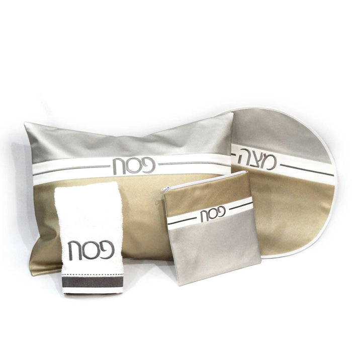 Horizontal Pesach Set in white and gold leather with multiple compartments and pouches arranged on white background.