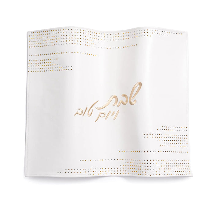 White leather Challah cover with gold studded decorative details and Hebrew text, elegant Shabbat table accessory