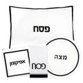 Hotel Style Pesach Set with leather components displayed, featuring circular plate and rectangular card holders in classic black and white design.
