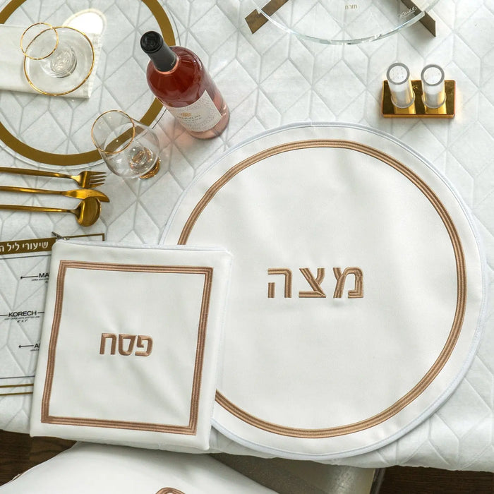 Hotel Style Pesach Set with leather accents featuring round and square plates with Hebrew text in elegant gold lettering.