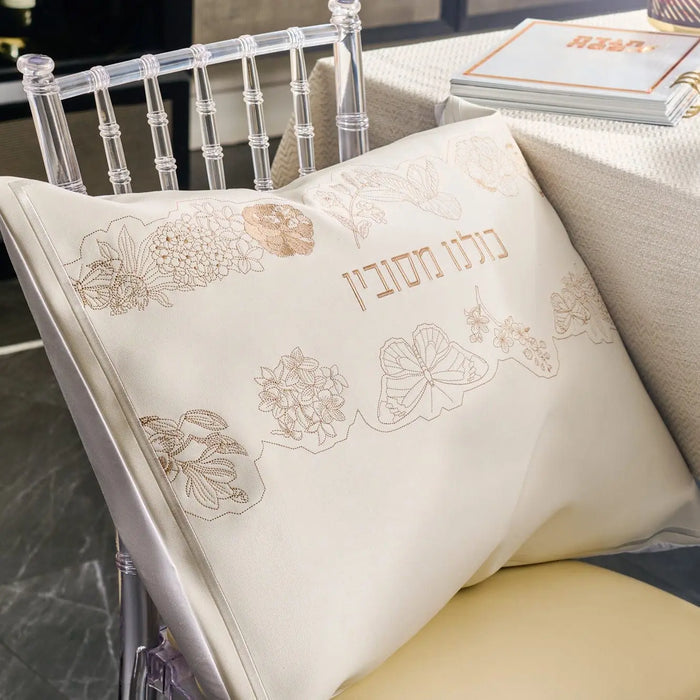 Waterdale Collection Inlay Floral Pesach Set in white and gold leather displayed on table with matching dinnerware and accessories.