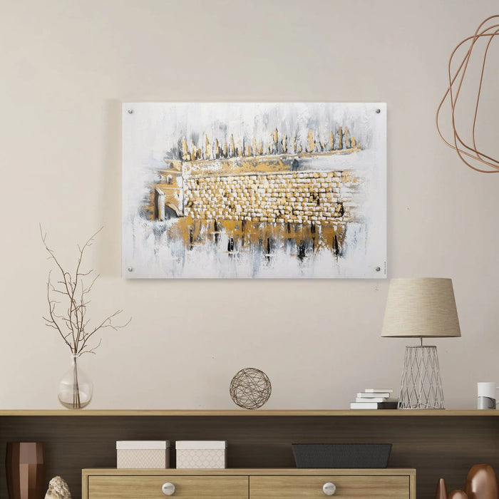 Kosel at Winter painting displayed on a beige wall above a wooden console table with a lamp and decorative objects.